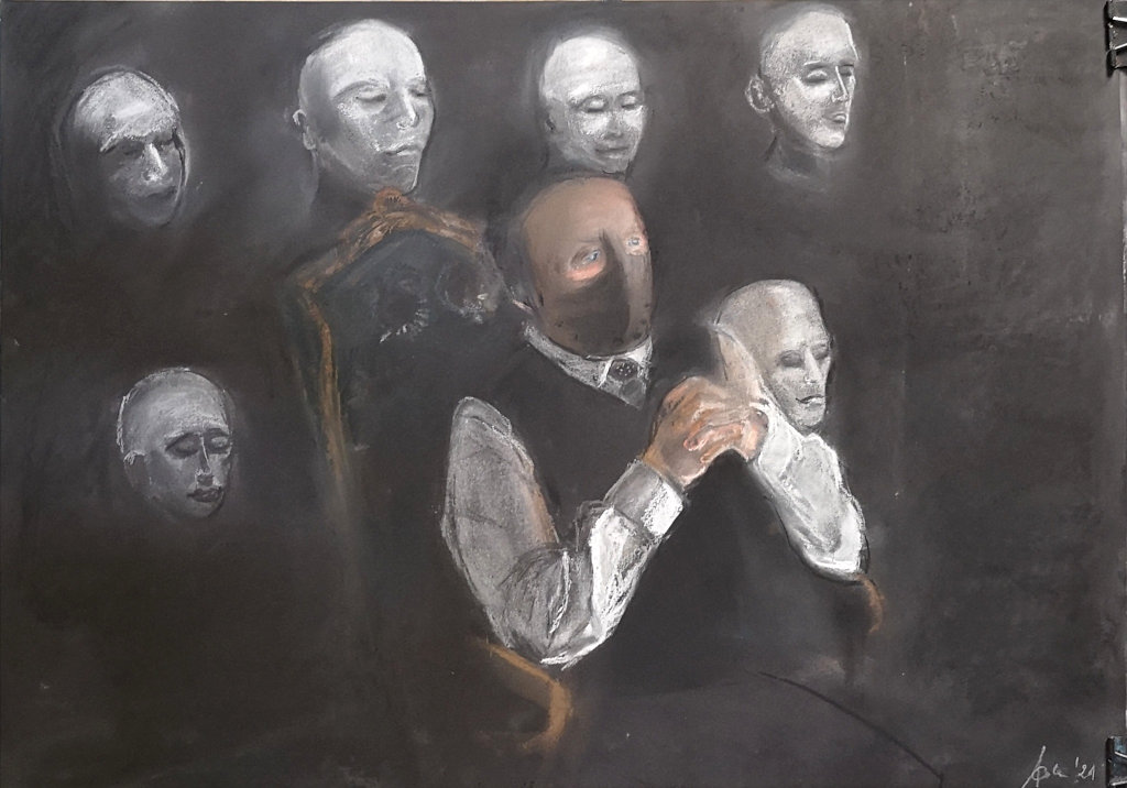 A man in a white shirt and a black vest is sitting in an armchair. He has a mask covering lower half of his face. There are six white faces luring from the darkness right behind him.