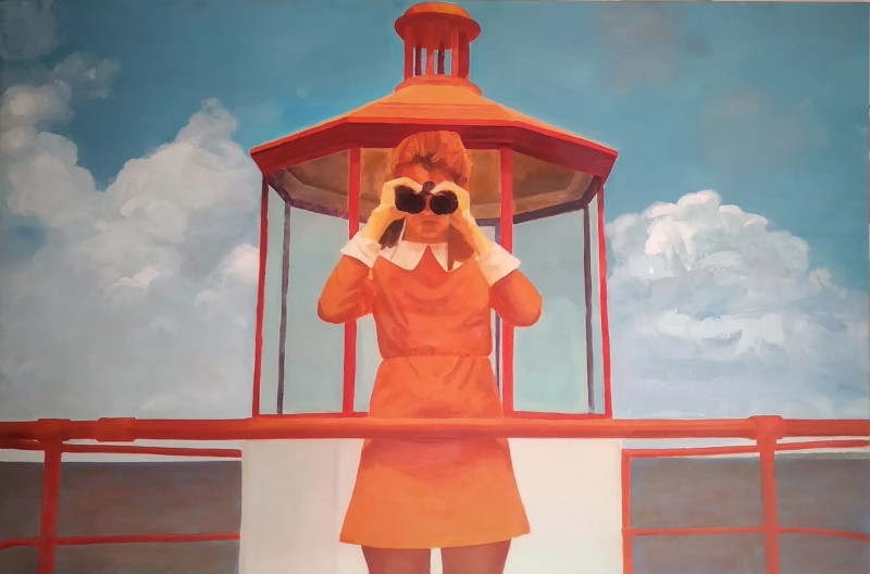 Girl in orange dress standing on a lighthouse top looking at sea through binoculars.